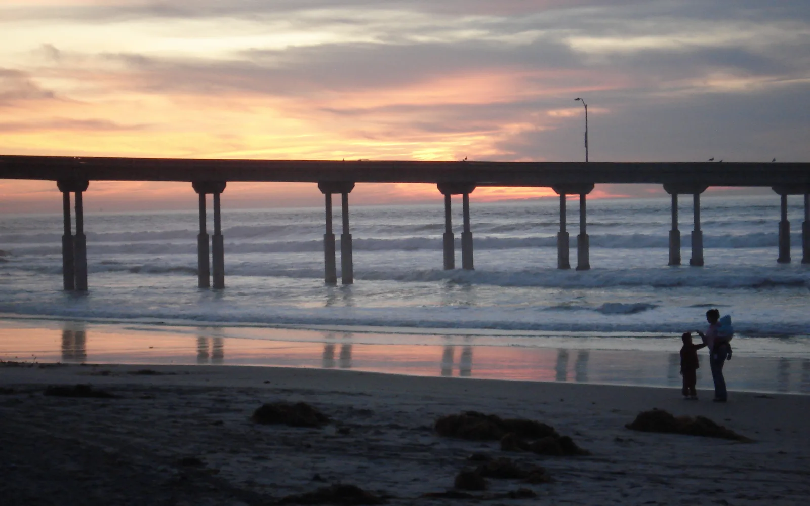 Ocean Beach in San Diego at sunset with calm waters and pleasant weather conditions